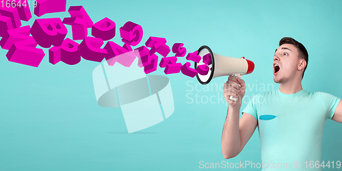 Image of Man shouting with megaphone, loudspeaker on studio background. Sales, offer, business, cheering fun concept.