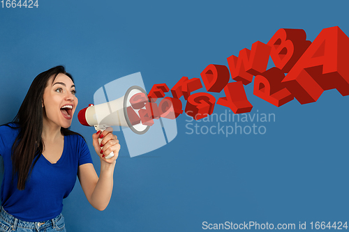 Image of Woman shouting with megaphone, loudspeaker on studio background. Sales, offer, business, cheering fun concept.