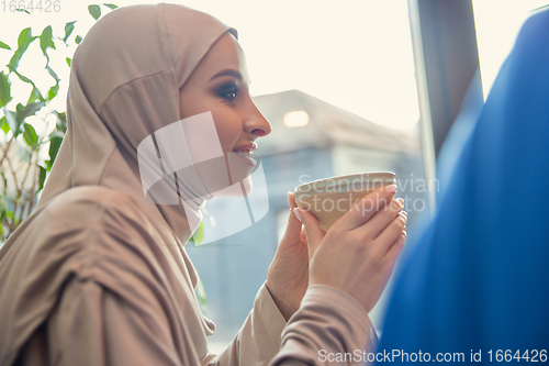 Image of Beautiful arab women meeting at cafe or restaurant, friends or business meeting