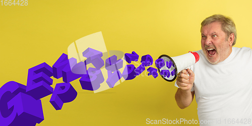 Image of Man shouting with megaphone, loudspeaker on studio background. Sales, offer, business, cheering fun concept.