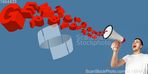 Image of Man shouting with megaphone, loudspeaker on studio background. Sales, offer, business, cheering fun concept.