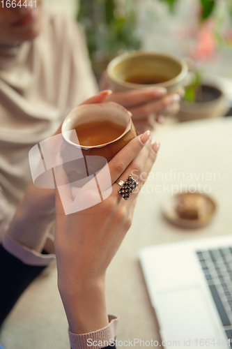 Image of Beautiful arab women meeting at cafe or restaurant, friends or business meeting