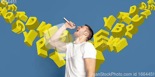 Image of Man shouting with speaker, microphone on studio background. Sales, offer, business, cheering fun concept.