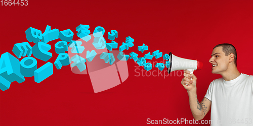 Image of Man shouting with megaphone, loudspeaker on studio background. Sales, offer, business, cheering fun concept.