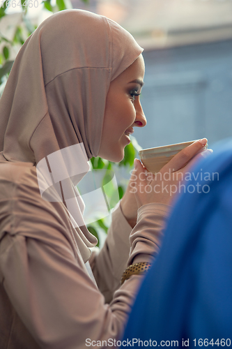 Image of Beautiful arab women meeting at cafe or restaurant, friends or business meeting