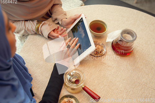 Image of Beautiful arab women meeting at cafe or restaurant, friends or business meeting