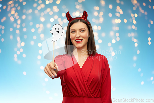 Image of happy woman in red halloween costume of devil