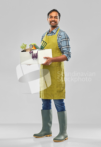 Image of indian gardener or farmer with box of garden tools