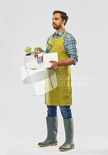 Image of indian gardener or farmer with box of garden tools