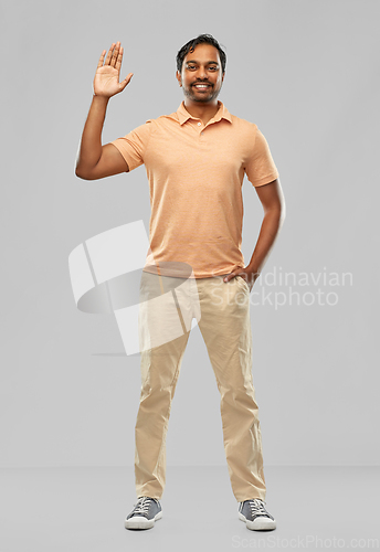 Image of portrait of happy smiling young indian man