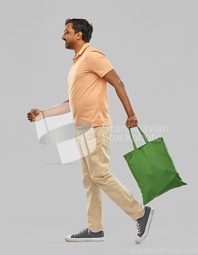 Image of man with reusable canvas bag for food shopping