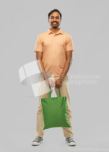 Image of man with reusable canvas bag for food shopping