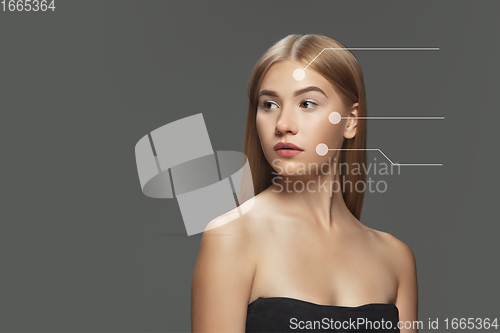 Image of Beautiful female face with lifting up arrows isolated on grey background