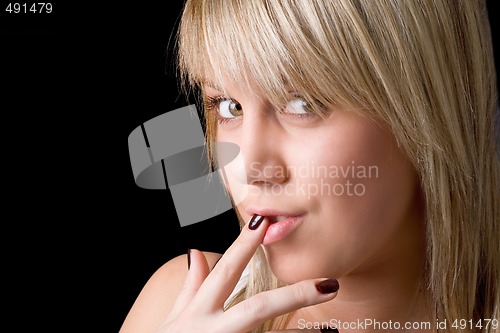 Image of portrait of the young beauty blonde. Isolated on black