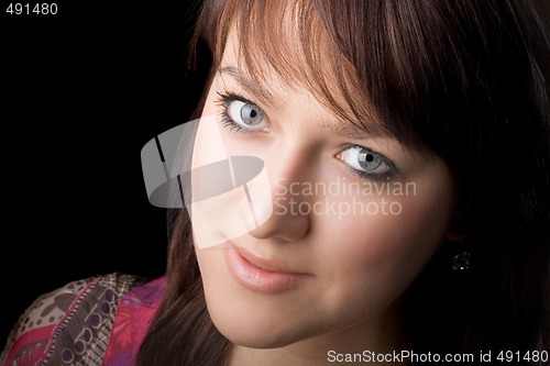 Image of portrait of the young beauty woman. Isolated on black