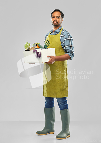 Image of indian gardener or farmer with box of garden tools