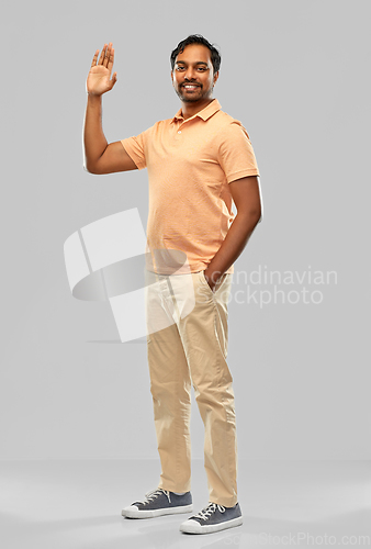 Image of portrait of happy smiling young indian man