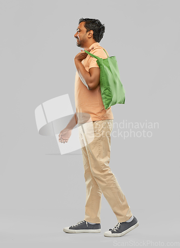 Image of man with reusable canvas bag for food shopping