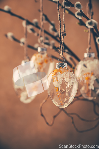 Image of Holidays and Easter concept - close up of pussy willow branches decorated with Easter eggs