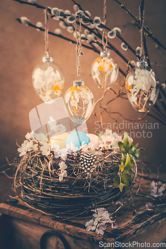 Image of Holidays and Easter concept - nest and pussy willow branches decorated with Easter eggs 