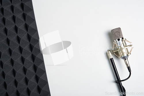 Image of Microphone on white background with copy space and acoustic foam panel