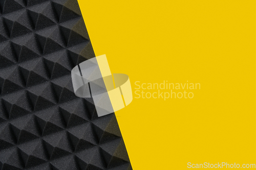 Image of Music background of acoustic foam panel on yellow copy space