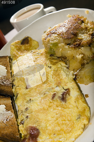 Image of egg omelette with home fries 