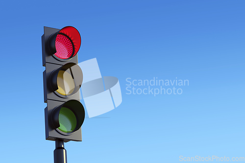 Image of Red traffic light against sky