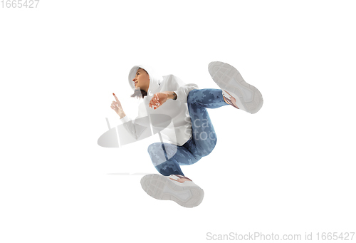 Image of Young stylish woman in modern street style outfit isolated on white background, shot from the bottom