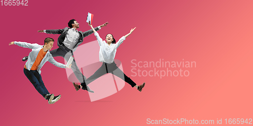 Image of Happy office workers jumping and dancing in casual clothes or suit on gradient neon fluid background. Flyer with copyspace