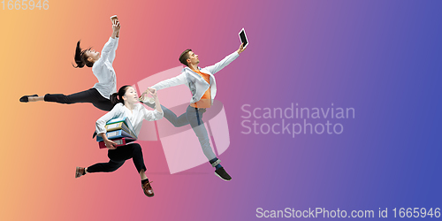 Image of Happy office workers jumping and dancing in casual clothes or suit on gradient neon fluid background. Flyer with copyspace