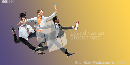 Image of Happy office workers jumping and dancing in casual clothes or suit on gradient neon fluid background. Flyer with copyspace