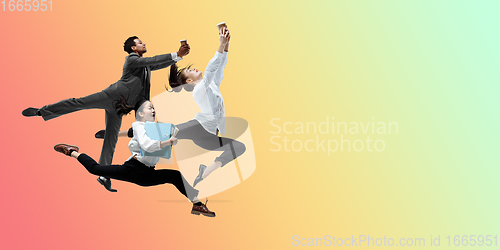 Image of Happy office workers jumping and dancing in casual clothes or suit on gradient neon fluid background. Flyer with copyspace