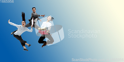 Image of Happy office workers jumping and dancing in casual clothes or suit on gradient neon fluid background. Flyer with copyspace