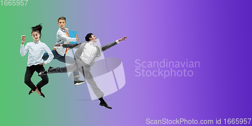 Image of Happy office workers jumping and dancing in casual clothes or suit on gradient neon fluid background. Flyer with copyspace