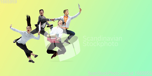 Image of Happy office workers jumping and dancing in casual clothes or suit on gradient neon fluid background. Flyer with copyspace