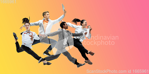 Image of Happy office workers jumping and dancing in casual clothes or suit on gradient neon fluid background. Flyer with copyspace