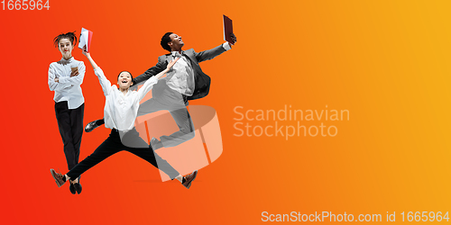 Image of Happy office workers jumping and dancing in casual clothes or suit on gradient neon fluid background. Flyer with copyspace