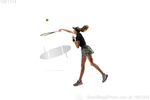 Image of Young caucasian professional sportswoman playing tennis isolated on white background