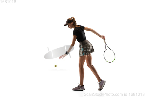 Image of Young caucasian professional sportswoman playing tennis isolated on white background