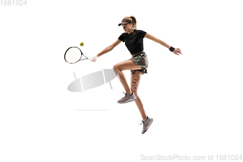 Image of Young caucasian professional sportswoman playing tennis isolated on white background