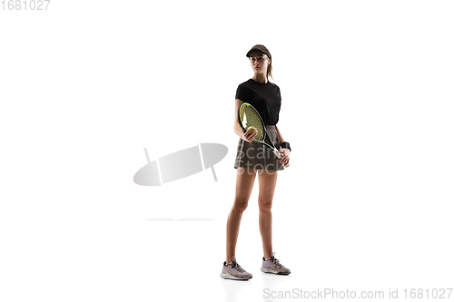 Image of Young caucasian professional sportswoman playing tennis isolated on white background