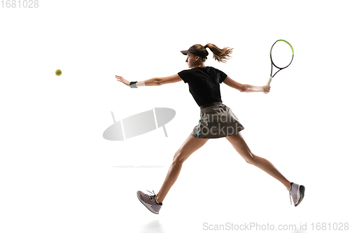 Image of Young caucasian professional sportswoman playing tennis isolated on white background