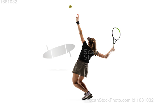 Image of Young caucasian professional sportswoman playing tennis isolated on white background