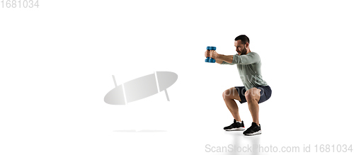 Image of Young caucasian male model in action, motion isolated on white background. Concept of sport, movement, energy and dynamic, healthy lifestyle. Training, practicing.