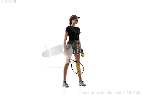 Image of Young caucasian professional sportswoman playing tennis isolated on white background