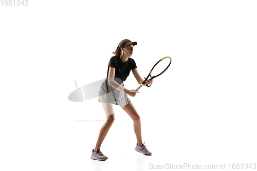 Image of Young caucasian professional sportswoman playing tennis isolated on white background