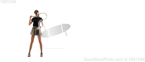 Image of Young caucasian professional sportswoman playing tennis isolated on white background