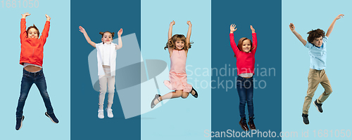 Image of Group of elementary school kids or pupils jumping in colorful casual clothes on blue studio background. Creative collage.