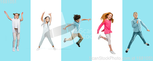 Image of Group of elementary school kids or pupils jumping in colorful casual clothes on bicolored studio background. Creative collage.